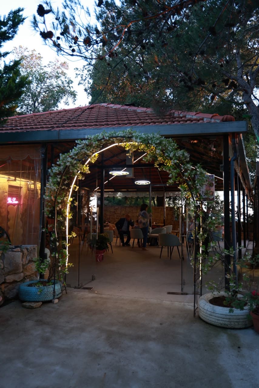 The floral archway at the entrance of The Lawn Cafe